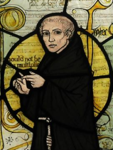 ویلیام اوکام بر روی شیشه رنگی در کلیسا به تصویر کشیده شده است (منبع: ویکیپدیا)